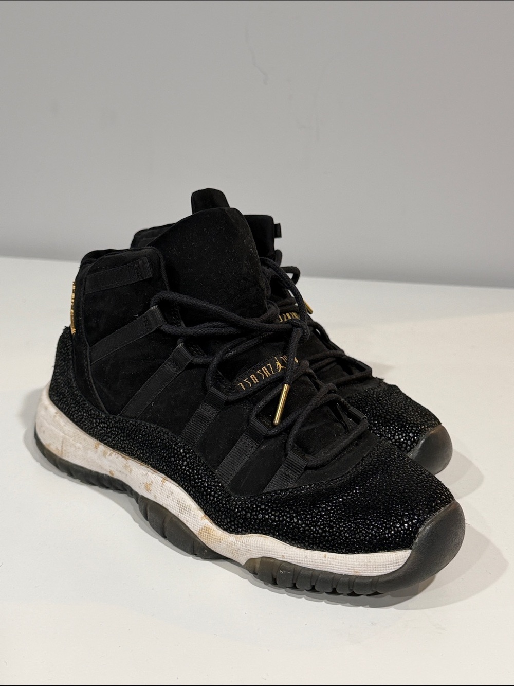Jordan Black and Gold High-Top Sneakers